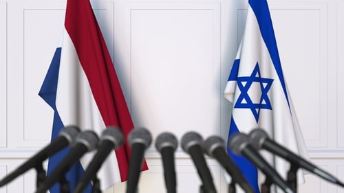 Flags of the Netherlands and Israel at International Press Conference