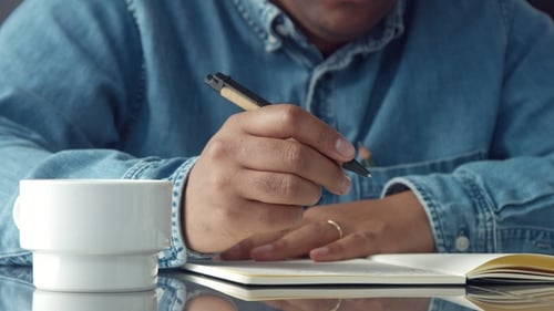 Man's Hands Making Notes. Writing Hands