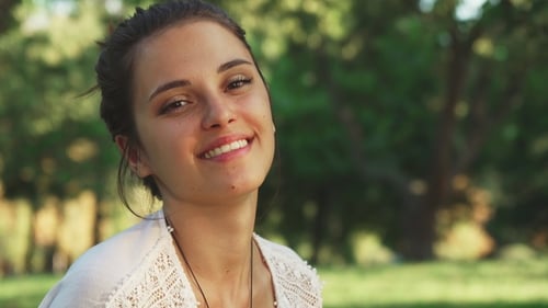 Young Woman Drinks Water Bottle Outdoors