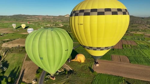 4K Aerial view of Goreme. Colorful hot air balloons fly over the valleys.