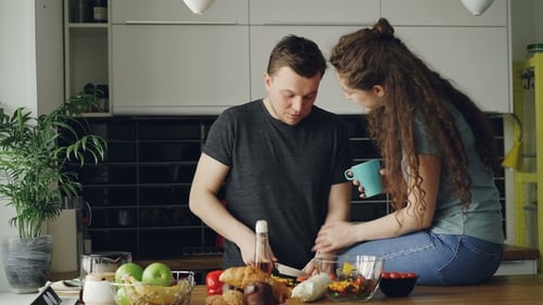 Couple Preparing Healthy Meal Together in Kitchen