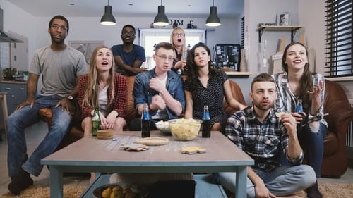Friends Cheer While Watching Sports Game Indoors