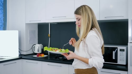 Healthy Lifestyle, Vegetarian Meal of Beautiful Girl with Plate of Lettuce in Hands During Dinner in