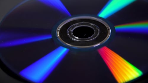 Compact Disk Isolated on Black Background. Abstract of Colorful Rainbow Reflection From Compact Di