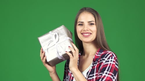 Stunning Happy Young Woman Shaking Present Box Guessing What Is Inside