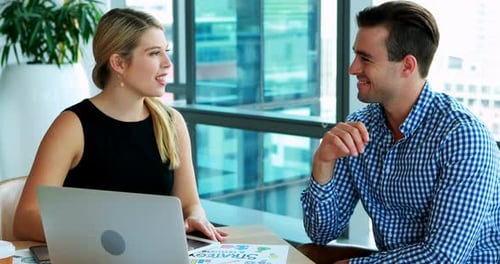 Business Meeting with Smiling Colleagues at an Office