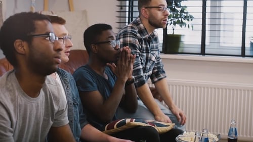 Friends Watching Television Together at Home