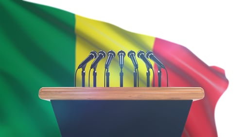 Press Conference Podium with Waving Flag Background