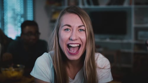 Attractive Caucasian Girl Blows Out Confetti Excited Happy Woman Blowing Glitter on a Party