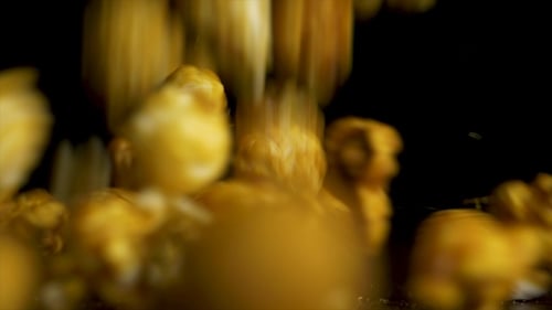 Delicious Caramel Popcorn Falling in Dramatic Close Up