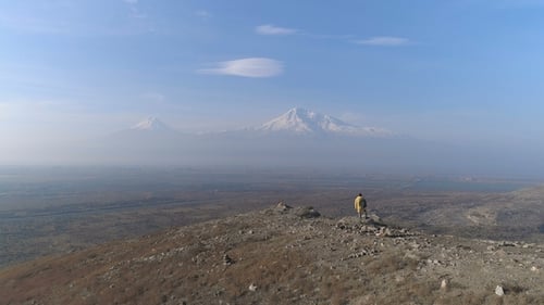 Aerial View Tourist Man Standing on the Mountain