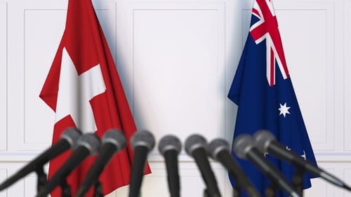 Flags of Switzerland and Australia at International Press Conference
