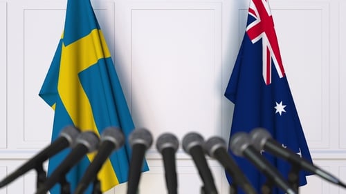 Flags of Sweden and Australia at International Press Conference