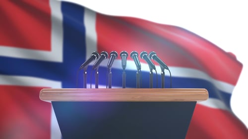 Press Conference Podium with Microphones and Waving Norwegian Flag
