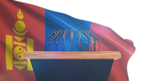 Podium with Microphones in Front of Waving Mongolian Flag