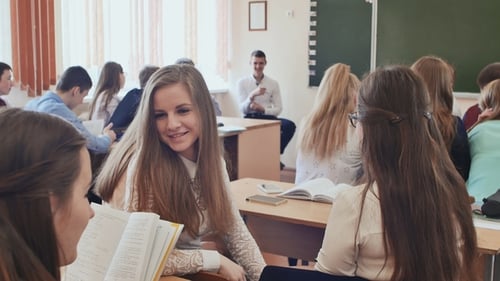 Students Communicate Between Lessons Sitting at a Desk. Russian School.