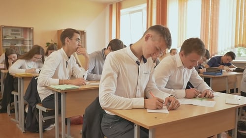 Russian School. Pupils Write a Control Exam in Their Notebooks.