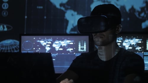 Man Using VR Headset in Dark Tech Room