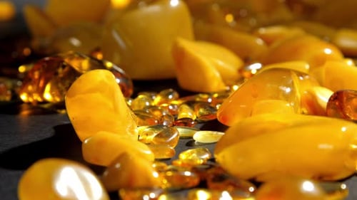 Yellow Transparent and Matt Amber Stones of Different Size