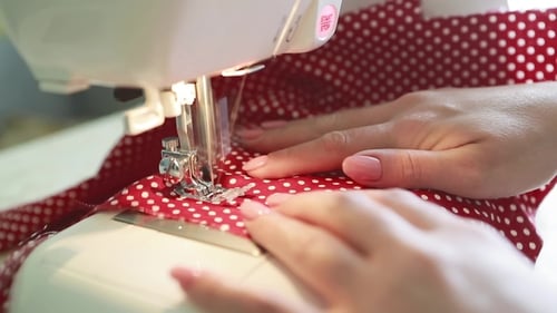 Woman Sewing at Home