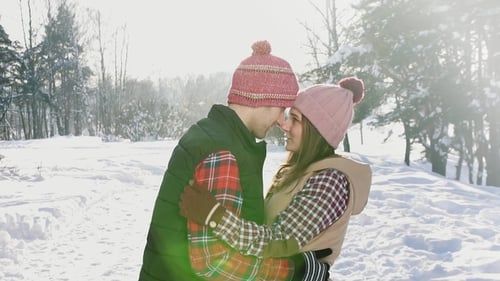 Man and Girl Couple Touching Their Heads in Winter Park, Sunny Day Snow,