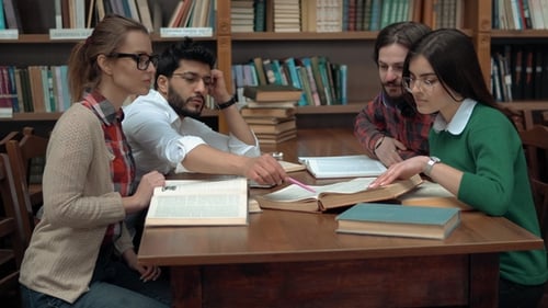 Guys Discuss Information at Table