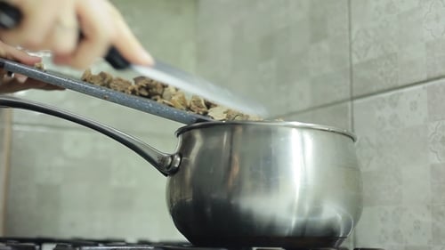 Pieces of Boiled Meat Pour Into a Saucepan
