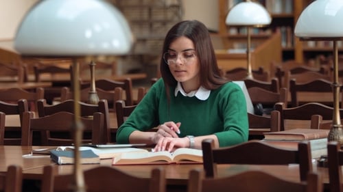 Focused Student Studies in Beautiful Library Setting