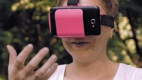 Woman Enjoys Virtual Reality Experience Outdoors