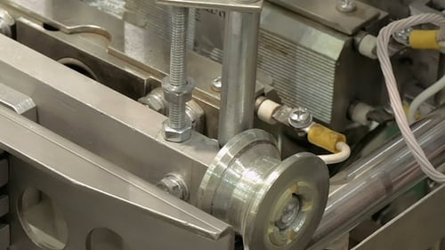 Factory Packing Machine with Pipes and Rolls