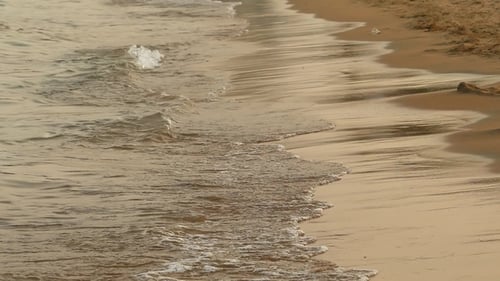 Soft Sea Waves Rushing at the Sunset