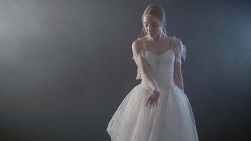 Young Woman Dancing Ballet in Studio