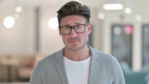 Man with Brown Hair Looking at Camera