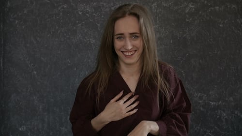 Cheerful Woman Laughing and Smiling Indoors