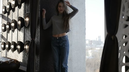 Girl in Roll-neck Sweater Is Standing