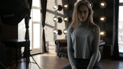 Young Woman Posing in a Studio Setting