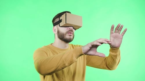 Man in Vr Headset on the Green Background
