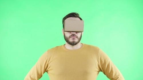 Man in Vr Headset Enjoy on the Green Background