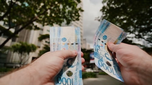 Counting Money on a City Street