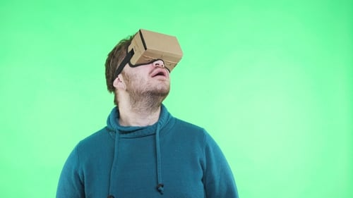 Man in Vr Headset Enjoy on the Green Background