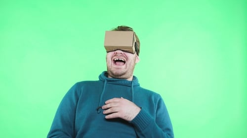 Man in Vr Headset Enjoy on the Green Background