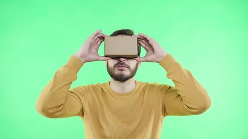 Man in Vr Glasses Enjoy on the Green Background