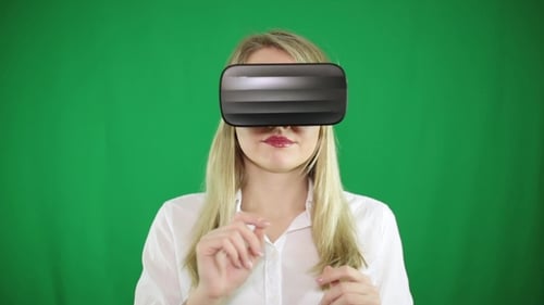 A Woman in VR Glasses Makes Gestures with Her Hands