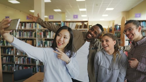 Students Take Selfie in the Library