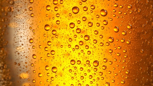 Glass of Beer turns slowly around its Axis