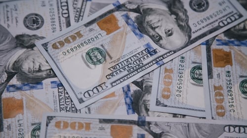 Background of Rotating Chaotic Scattered 100 Dollars Bills