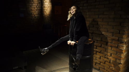 Stylish Woman Posing in Dark Urban Interior