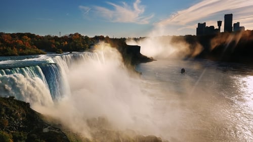 Incredible Niagara Falls at Sunset. The Sun's Rays Shine on the Canadian Shore in the Direction of