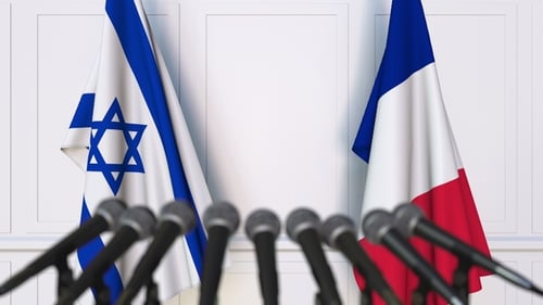 Flags of Israel and France at International Press Conference