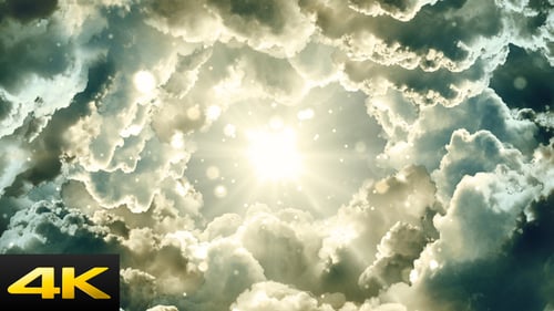Heavenly Light Rays Shining Through Moving Clouds with Glittering Particles